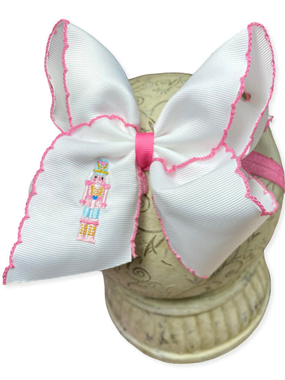 Pink Nutcracker Embroidered Moonstitch Headband on a white background