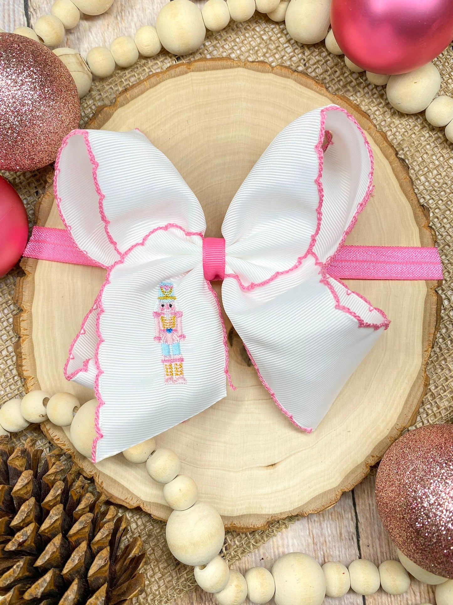 Pink Nutcracker headband on wood