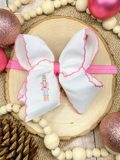 Pink Nutcracker headband on wood