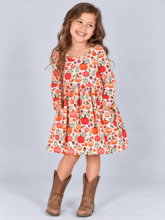 Girl wearing the pink pumpkin pocket dress