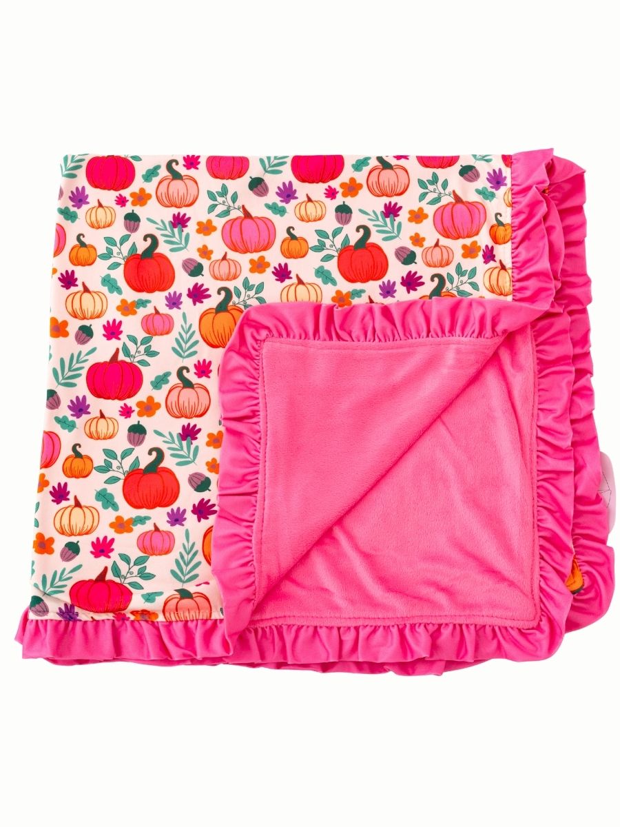Pink pumpkin fall baby blanket with plush backing and ruffle trim