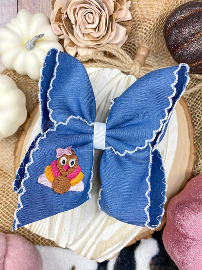 Pink Turkey Moonstitch on Denim Hair Bow on a wooden background