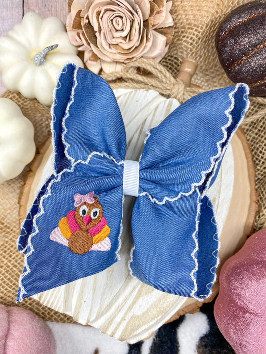 Pink Turkey Moonstitch on Denim Hair Bow on a wooden background