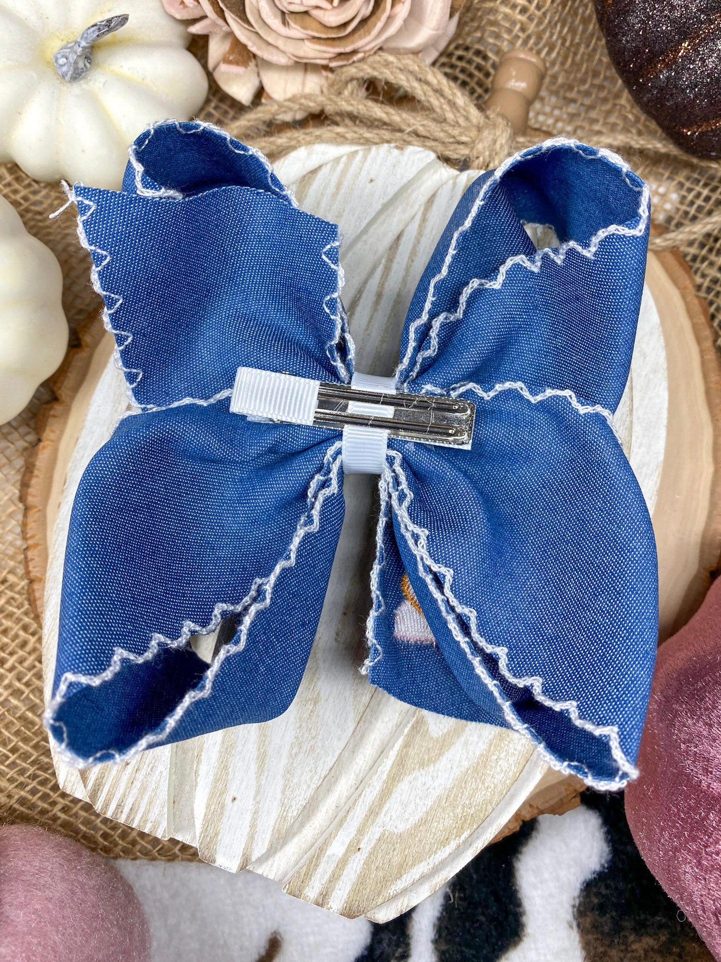 Pink Turkey Moonstitch on Denim Hair Bow on a wooden background