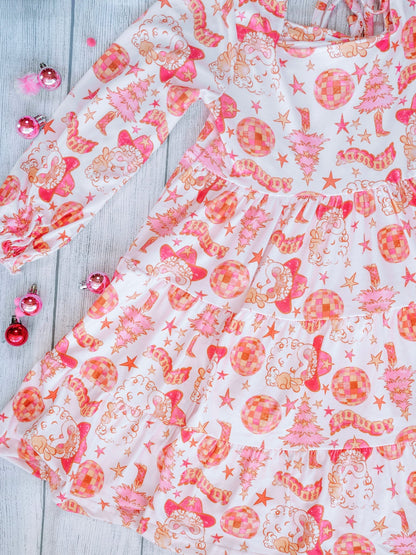 Close-up of pink and orange western Santa print fabric