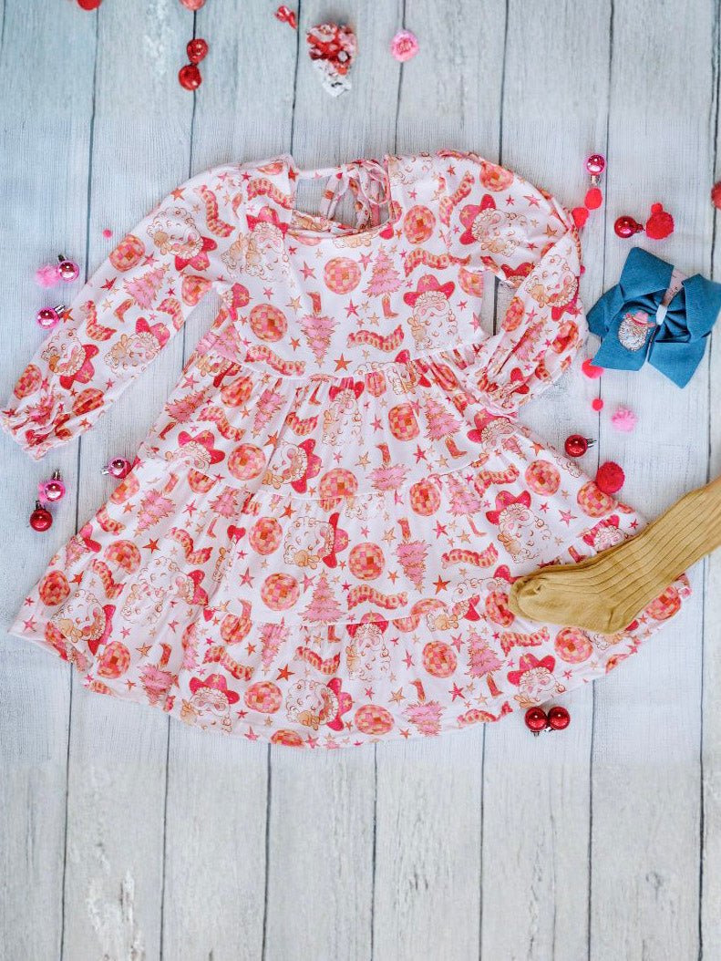 western santa dress with long sleeves on a wooden surface with decorative items.