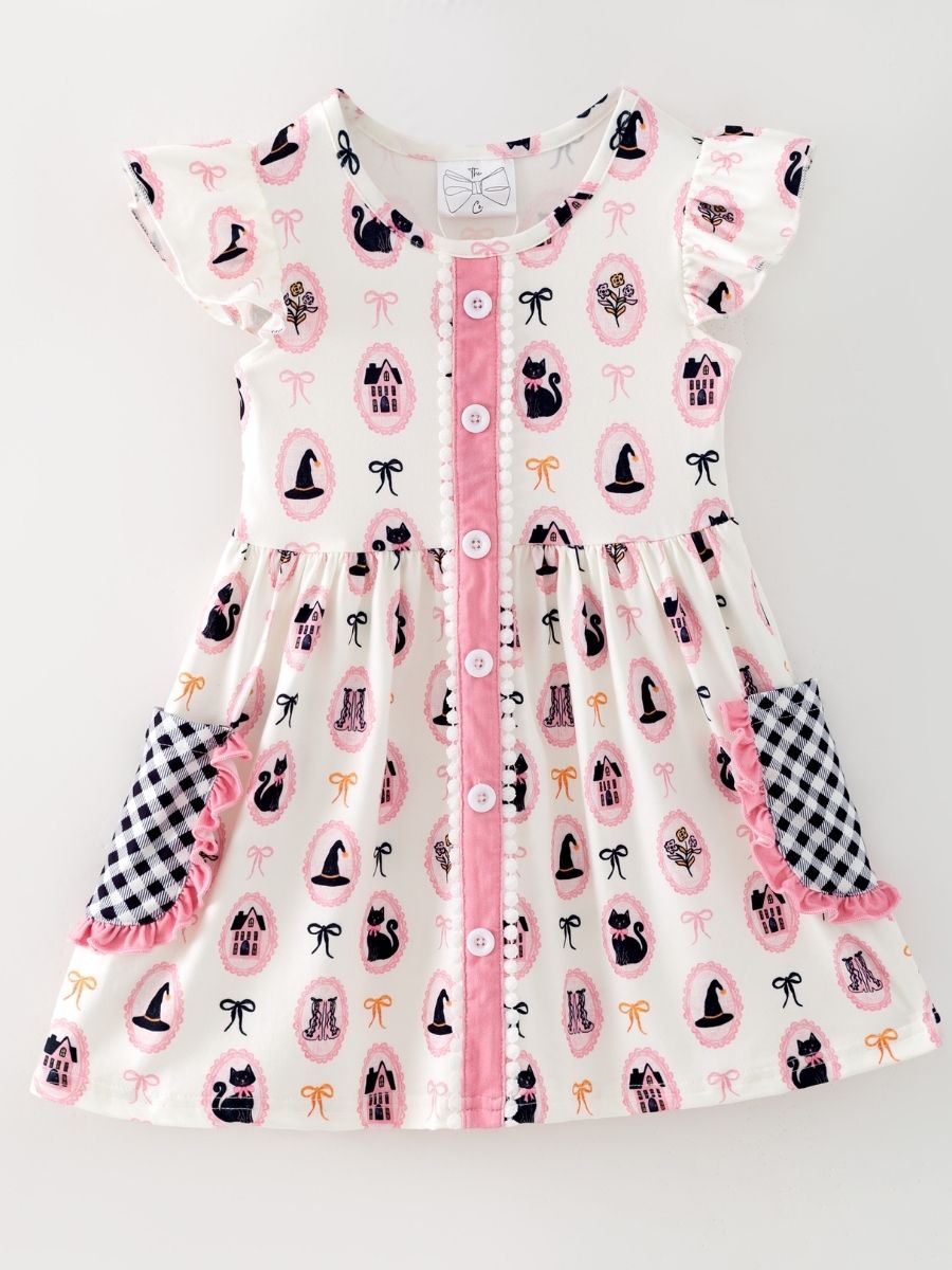 girls Halloween boutique dress with pink and black print and check ruffle pockets