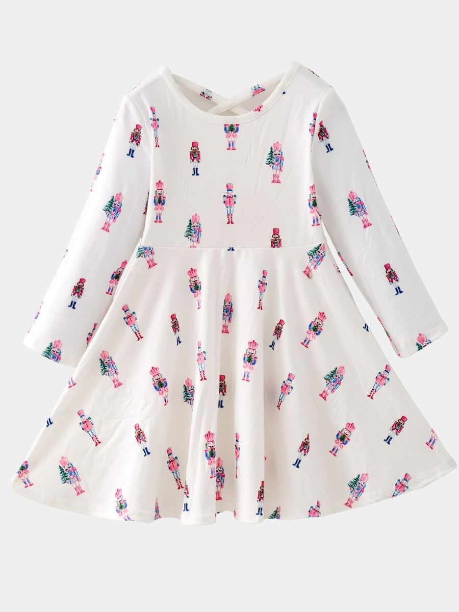 Pink Nutcracker Christmas twirl dress featuring a pastel nutcracker print, long sleeves, and a full twirl skirt for girls.