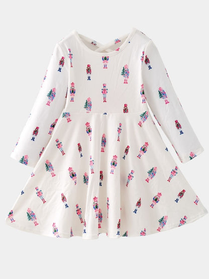 Pink Nutcracker Christmas twirl dress featuring a pastel nutcracker print, long sleeves, and a full twirl skirt for girls.