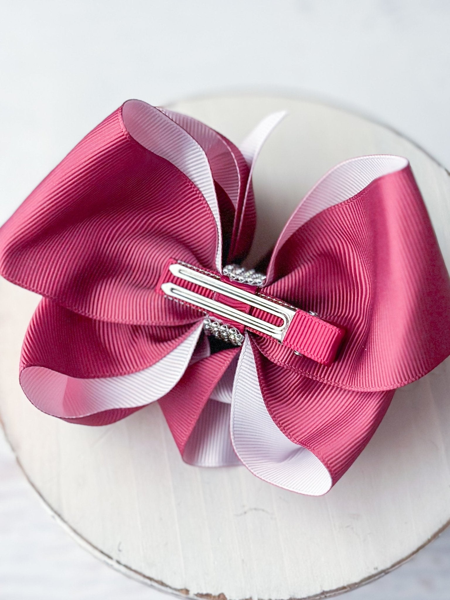 Back of original size bow with double prong alligator clip