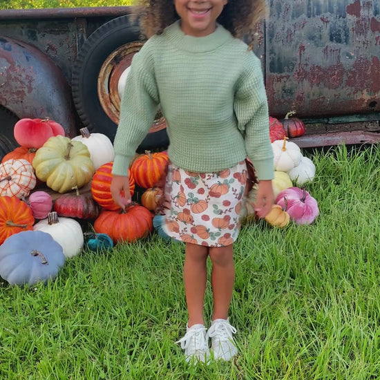 pumpkin fringe skirt and sweater set on model 