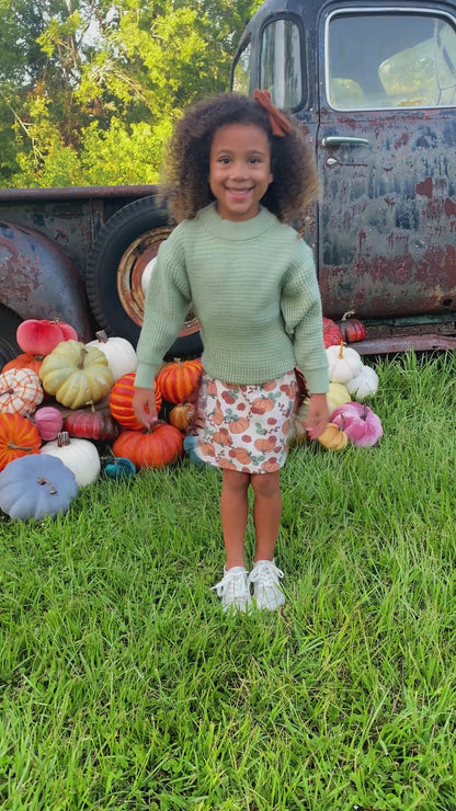 pumpkin fringe skirt and sweater set on model 