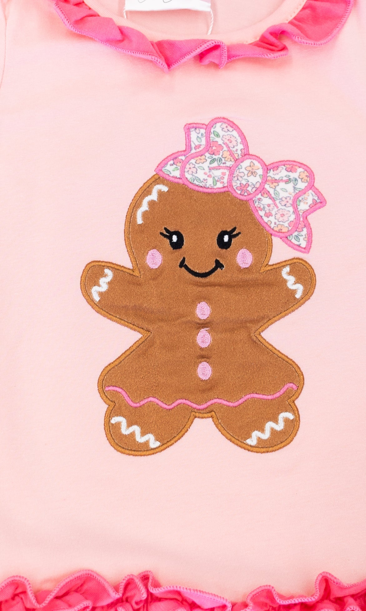 close up of the gingerbread applique with a bow