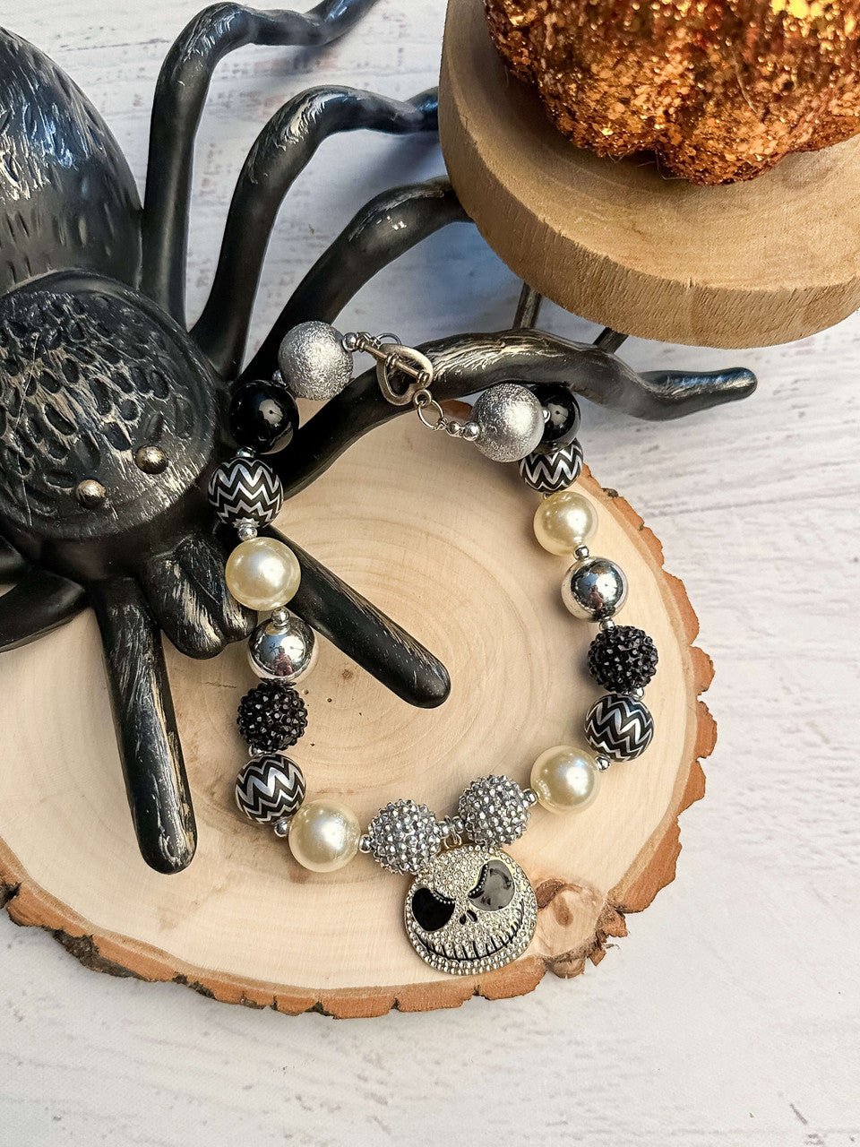 Black and white chunky bead necklace with a Pumpkin King pendant