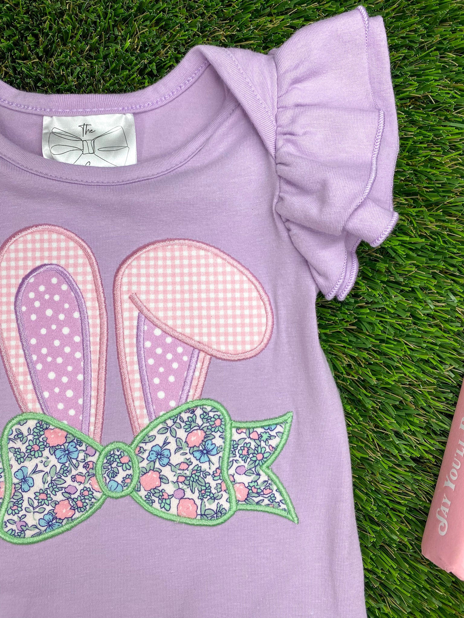Shoulder ruffle and applique of Purple Bunny Appliqué Easter Infant Romper