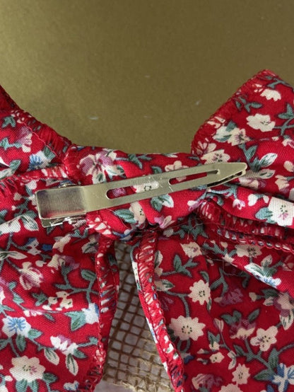 Red floral hand tied hair bow with metal alligator clip