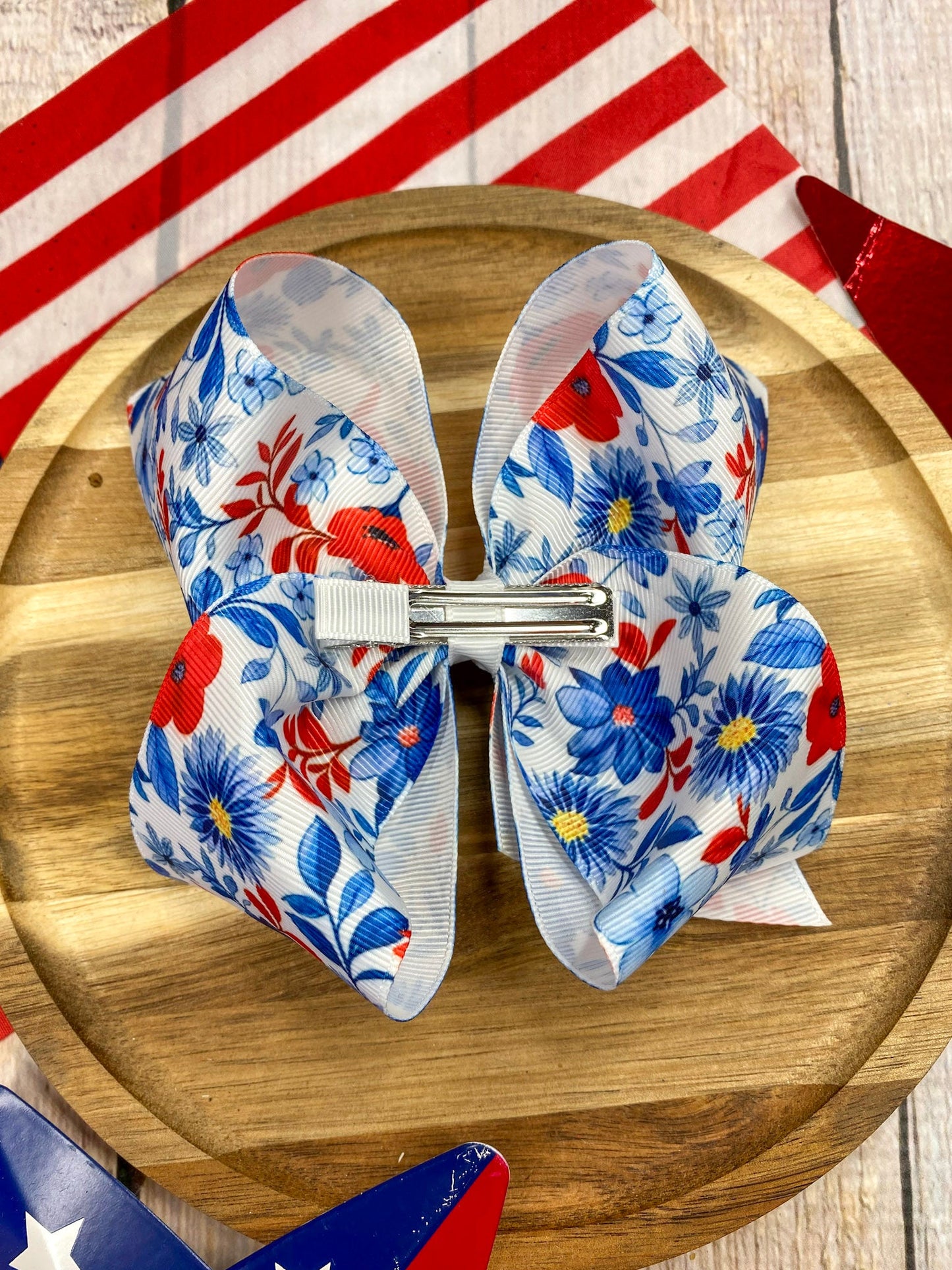 Red White & Blue Floral hairbow on a wooden background
