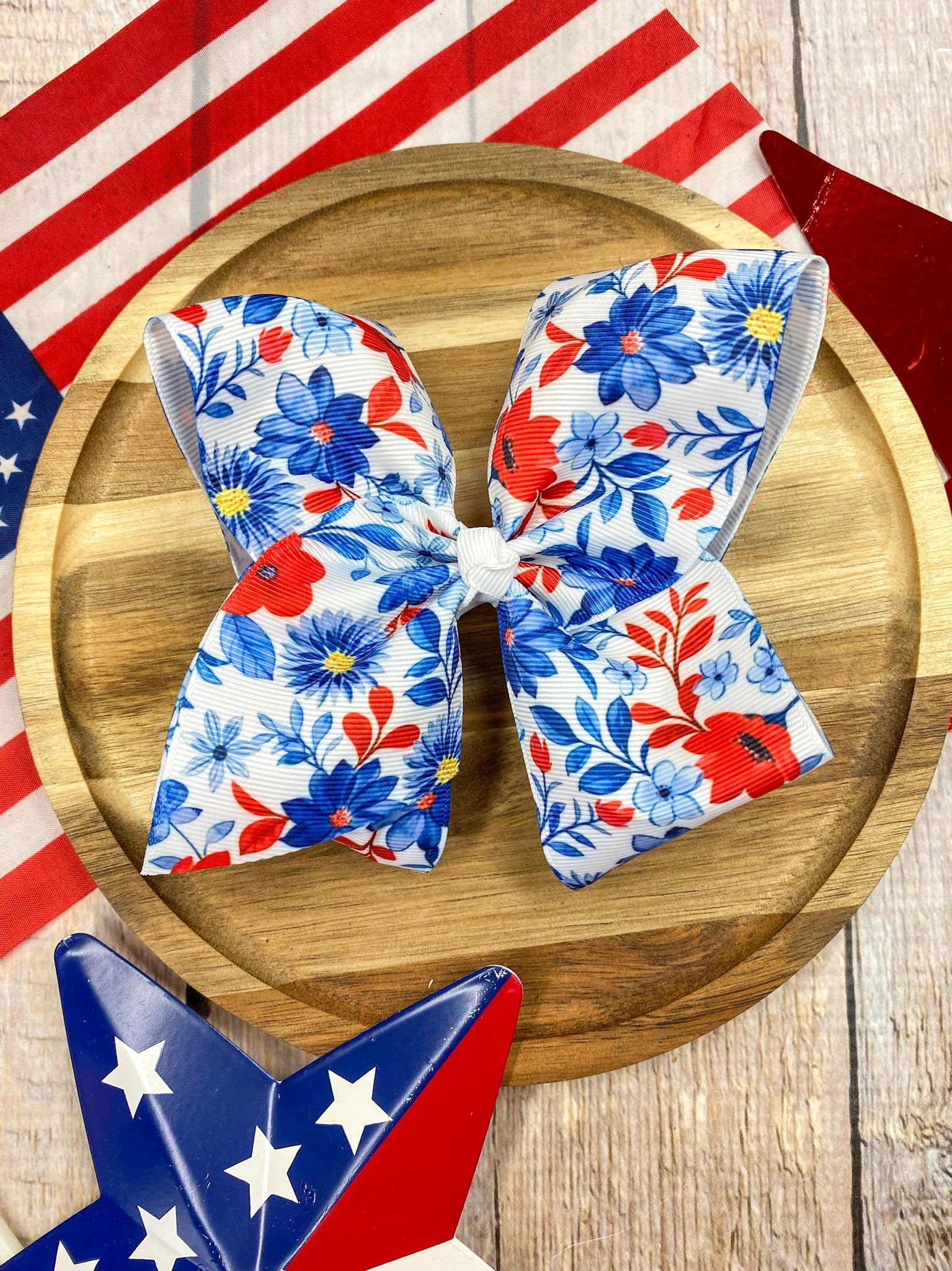 Red White & Blue Floral hairbow on a wooden background