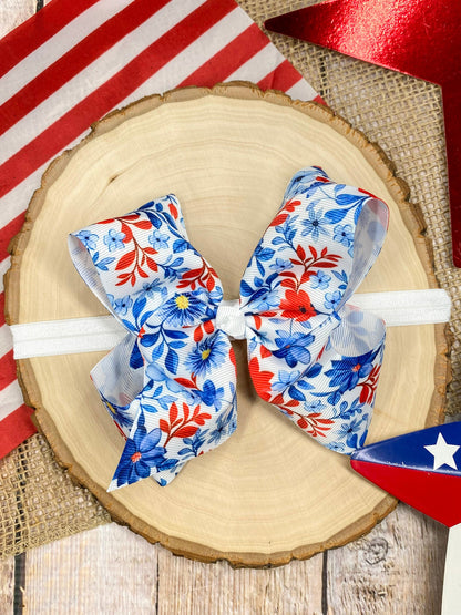 Red White & Blue Floral headband on a wooden background