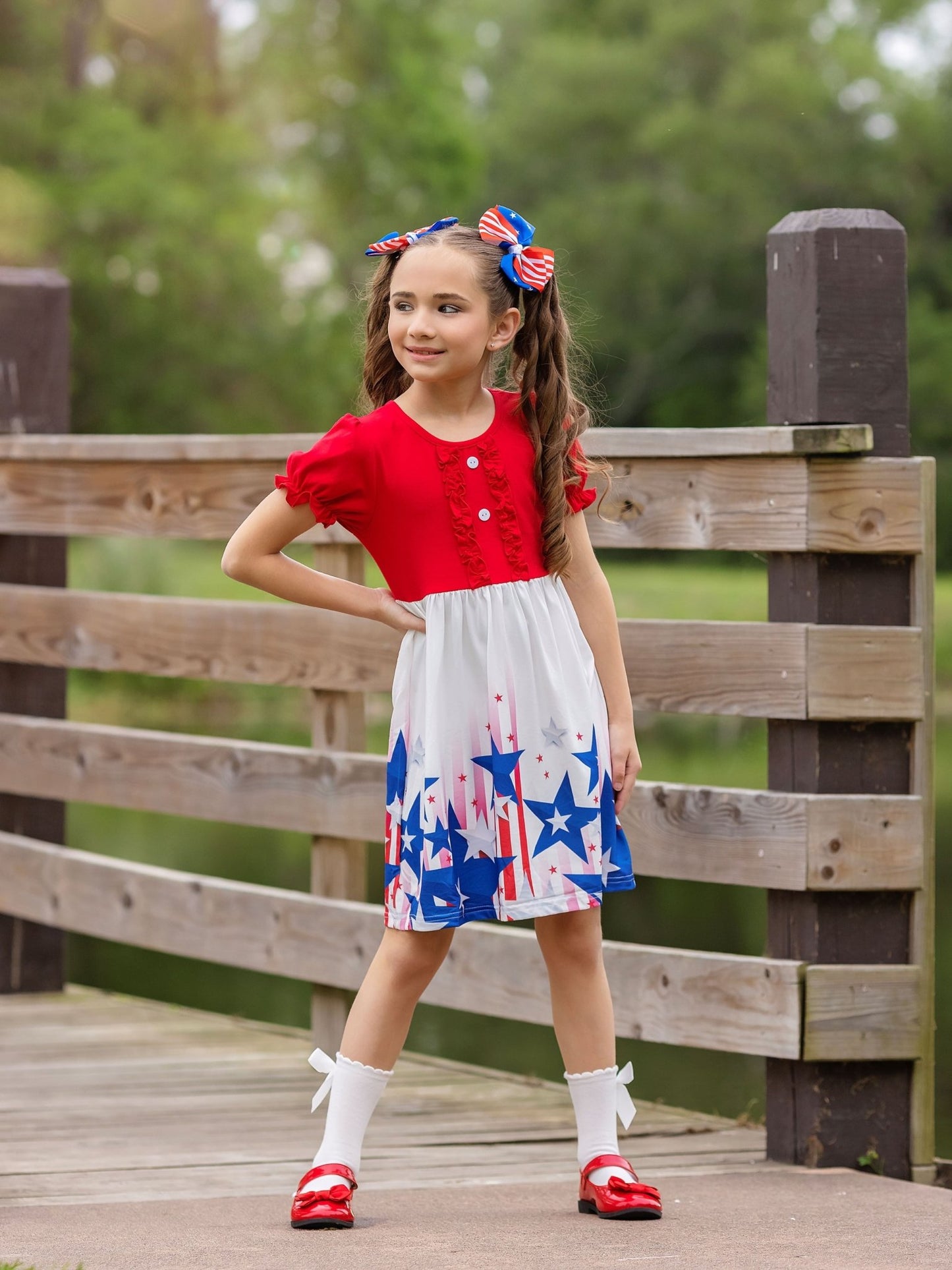model wearing the Red, White, & Blue Shooting Stars Girl's Dress