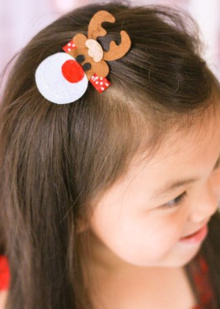 Girl wearing a Rudolph the reindeer felt clippie - Alternative view
