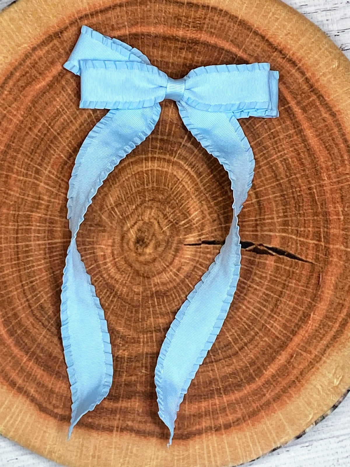 Light blue ruffle edge ribbon hair bow on alligator clip