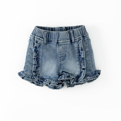 Denim shorts with ruffled edges on a white background