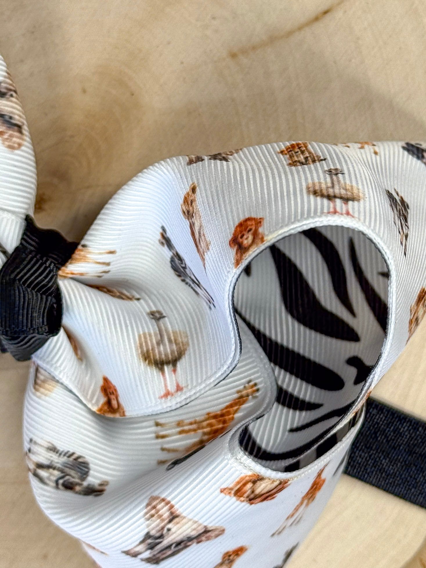 Close-up of a ribbon with animal print on a beige background