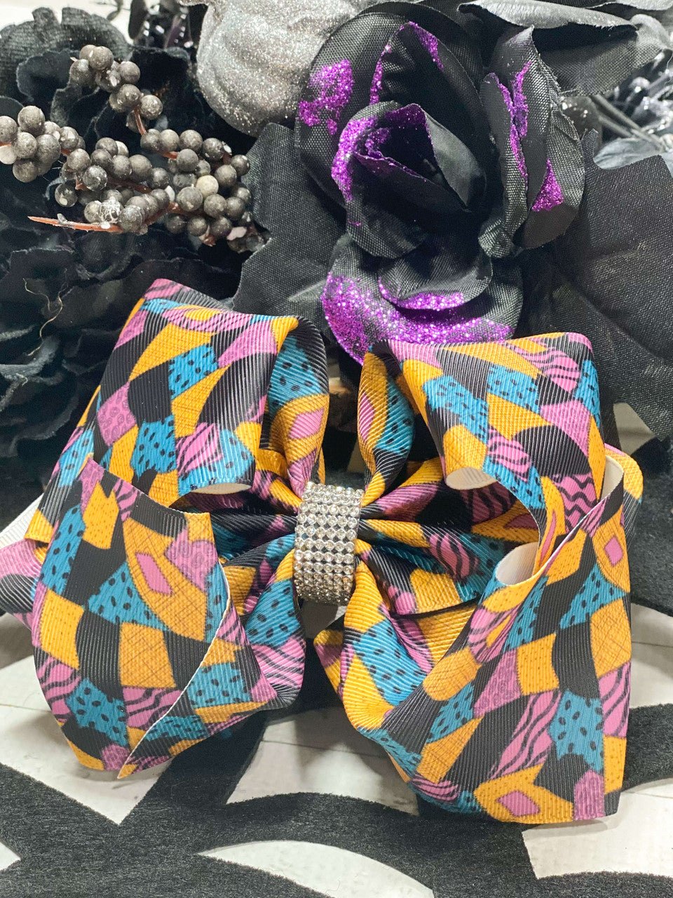 Sally print hair bow with rhinestone center