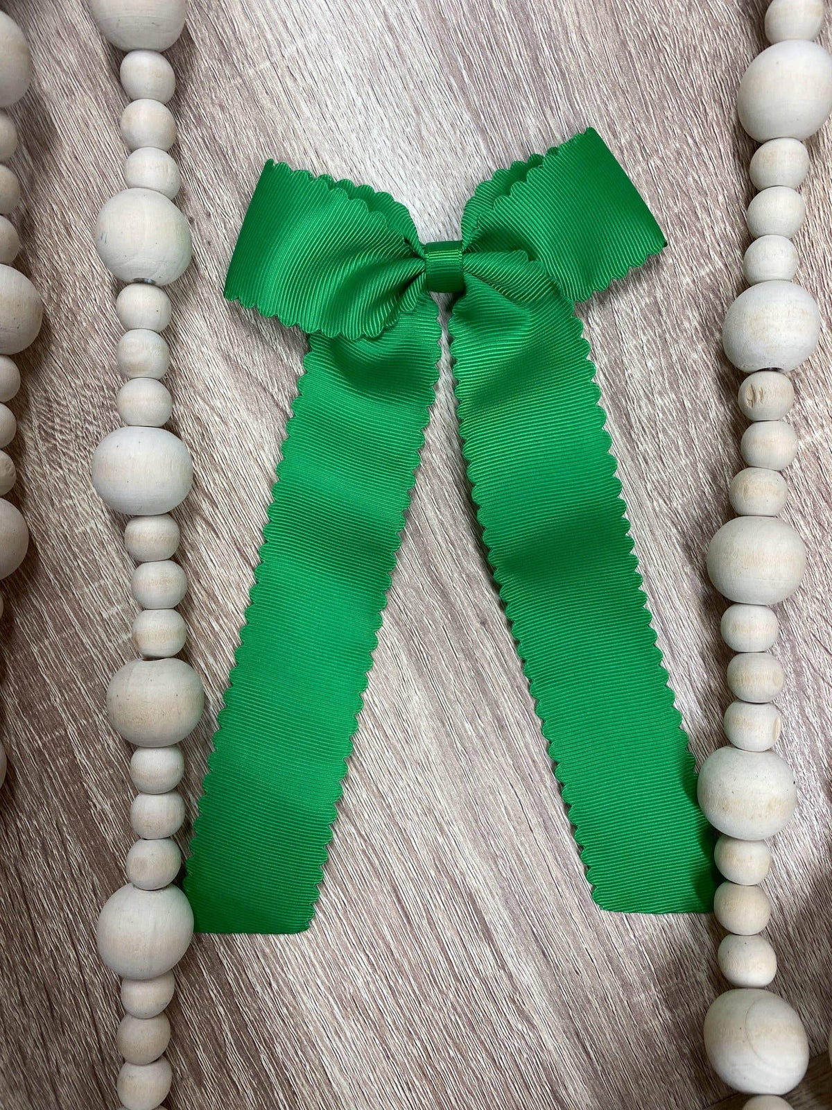 Emerald scalloped long tail hair bow on alligator clip
