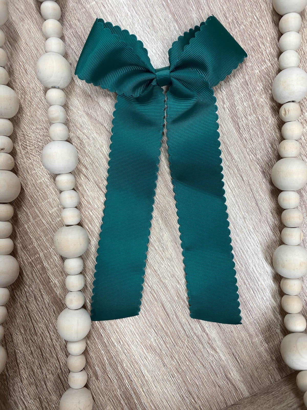 Hunter green scalloped long tail hair bow on alligator clip