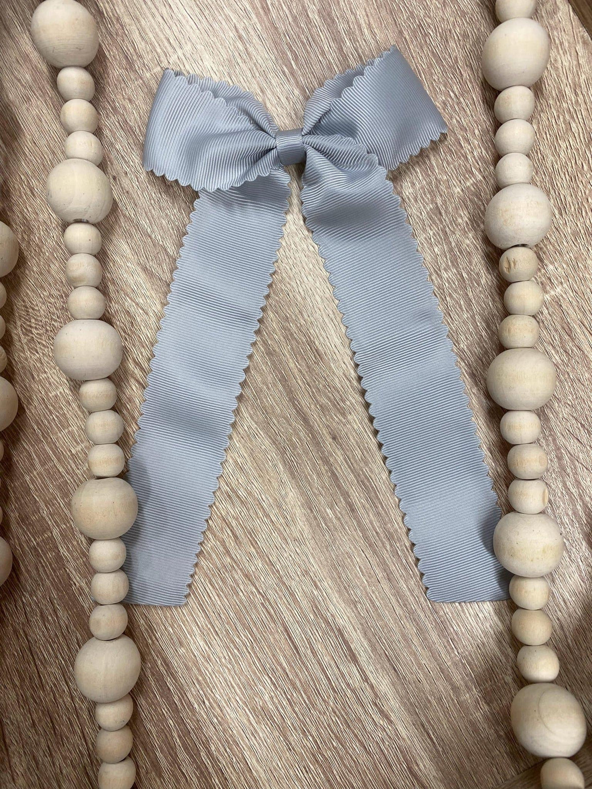 Silver scalloped long tail hair bow on alligator clip