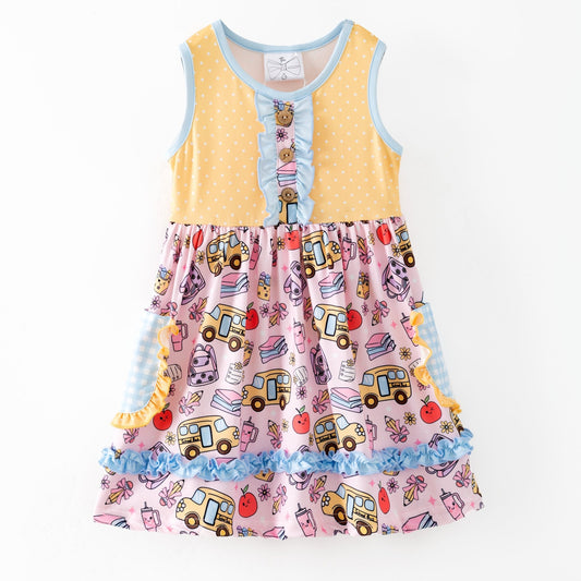 Colorful children's dress with cartoon bus and apple pattern on a white background