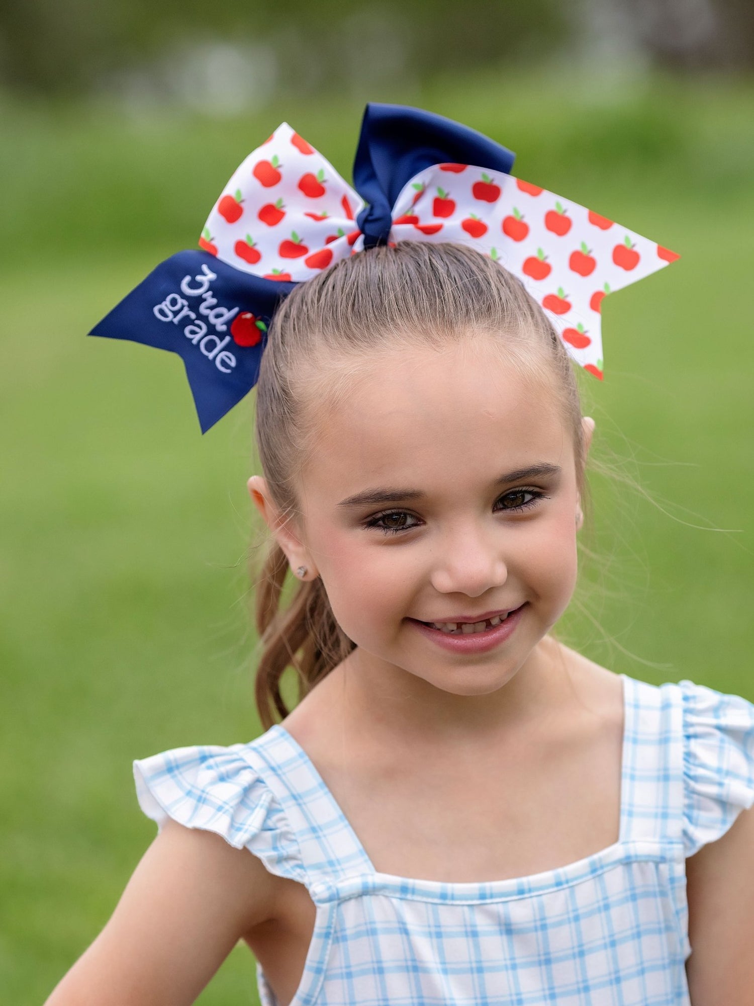 model wearing 3rd grade School Grade Embroidered Cheer Bow