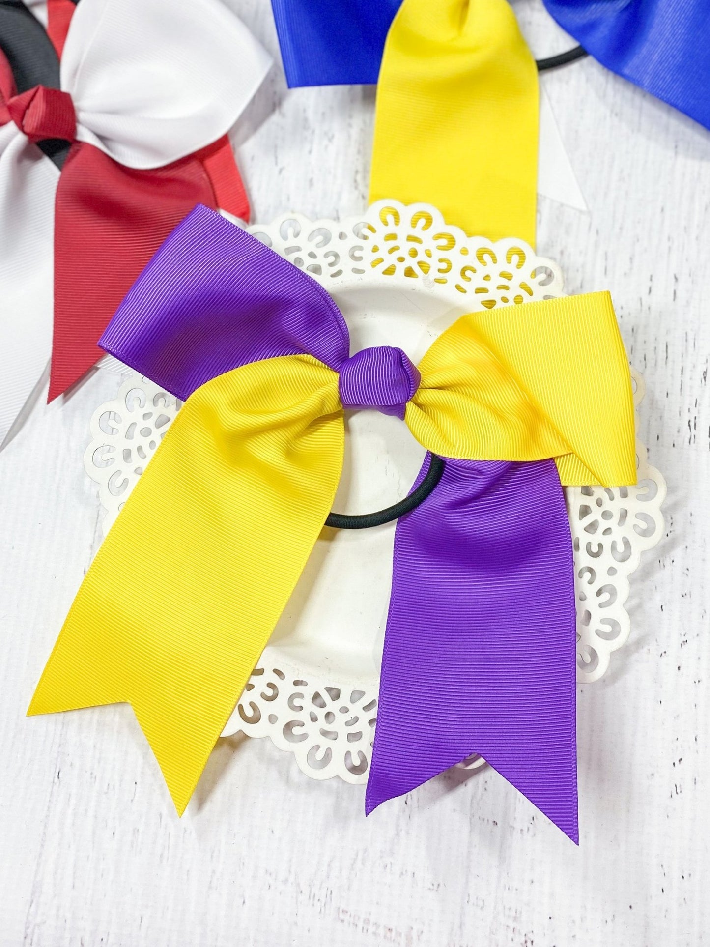 purple and yellow school spirit cheer bow