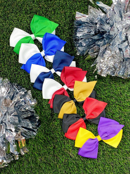 Oversized school spirit hair bows in assorted team colors