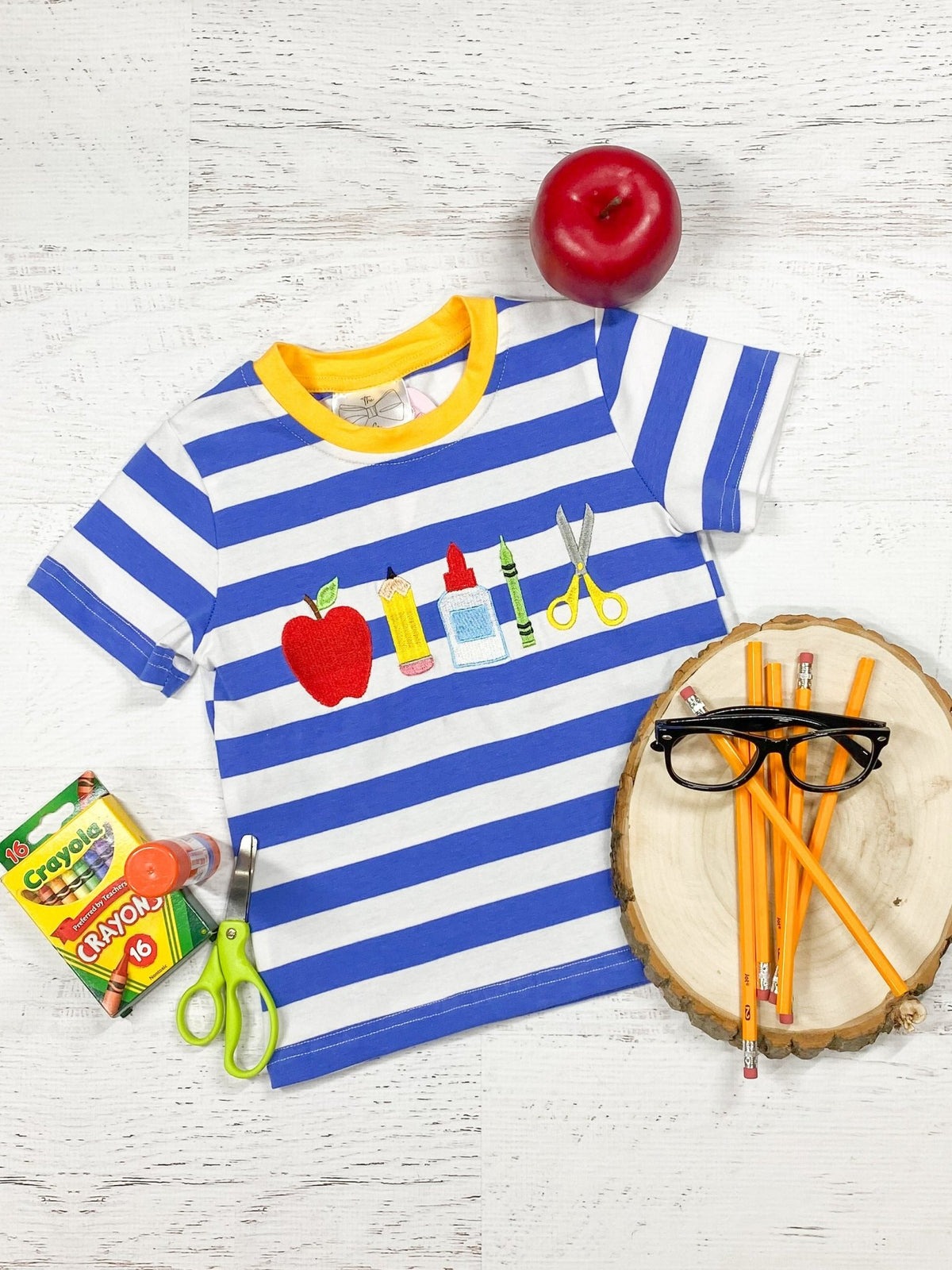 Blue striped school supplies tee with a yellow collar