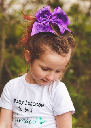 Girl wearing purple sequin cheer hair bow - Alternative view