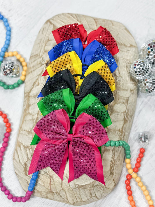 assortment of sequin cheer hair bows in multiple colors