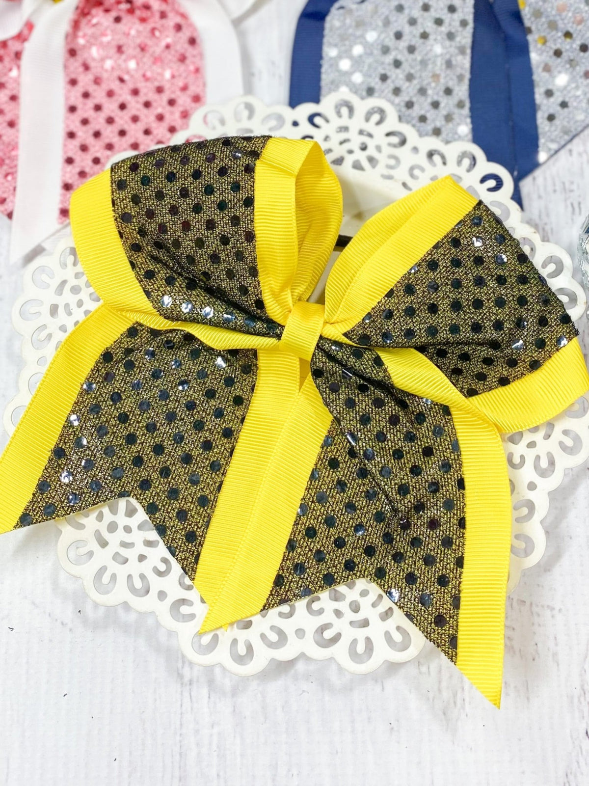 Black and yellow sequin school spirit cheer bow on pony-o