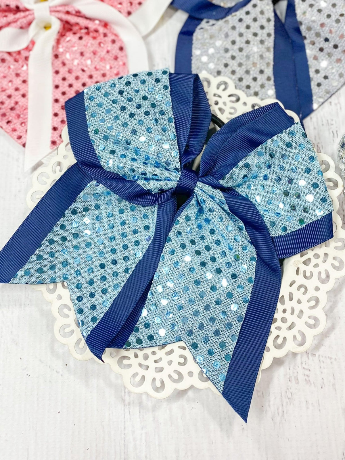 Light blue and navy sequin school spirit cheer bow on pony-o