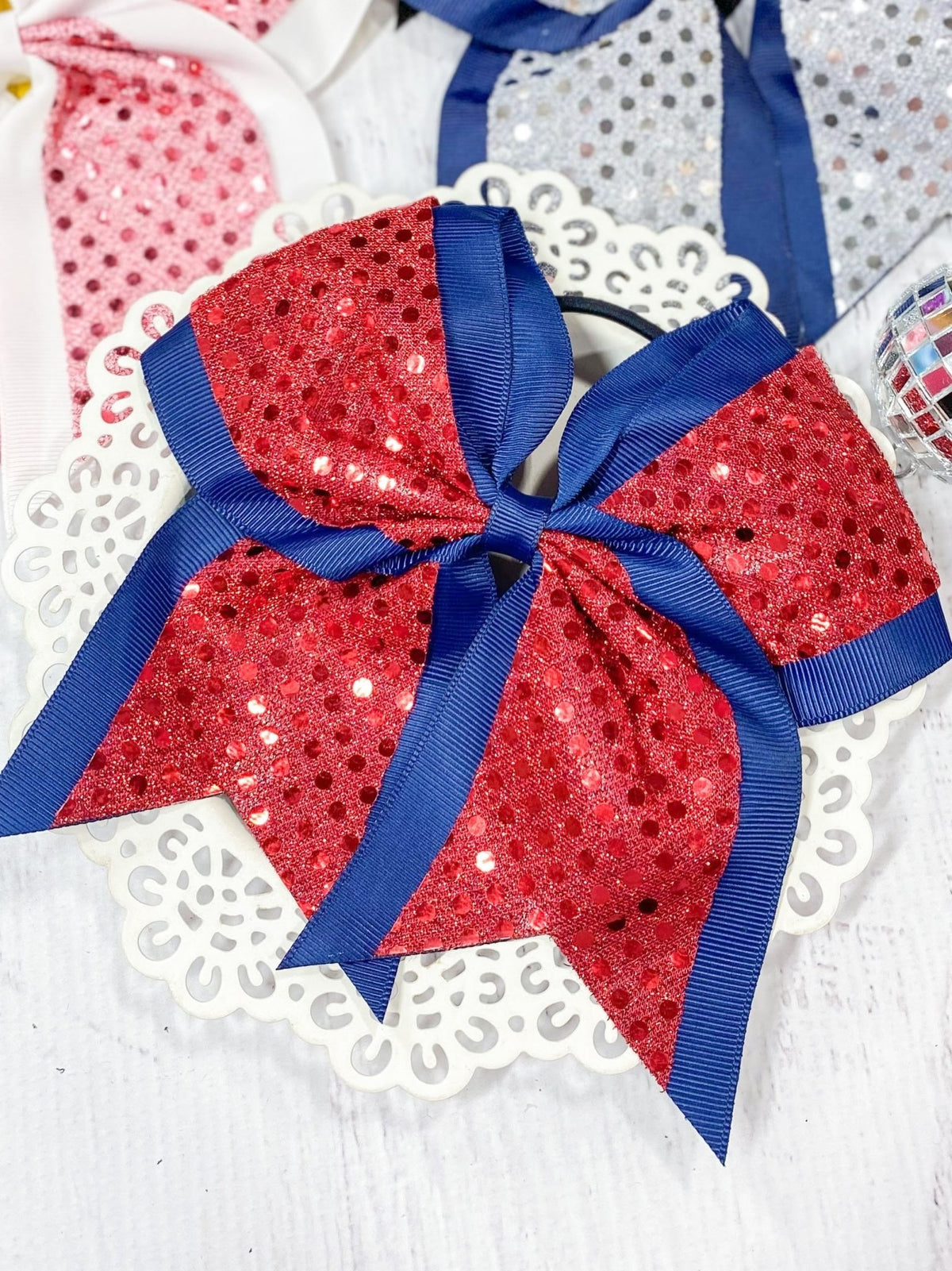 Red and navy sequin school spirit cheer bow on pony-o