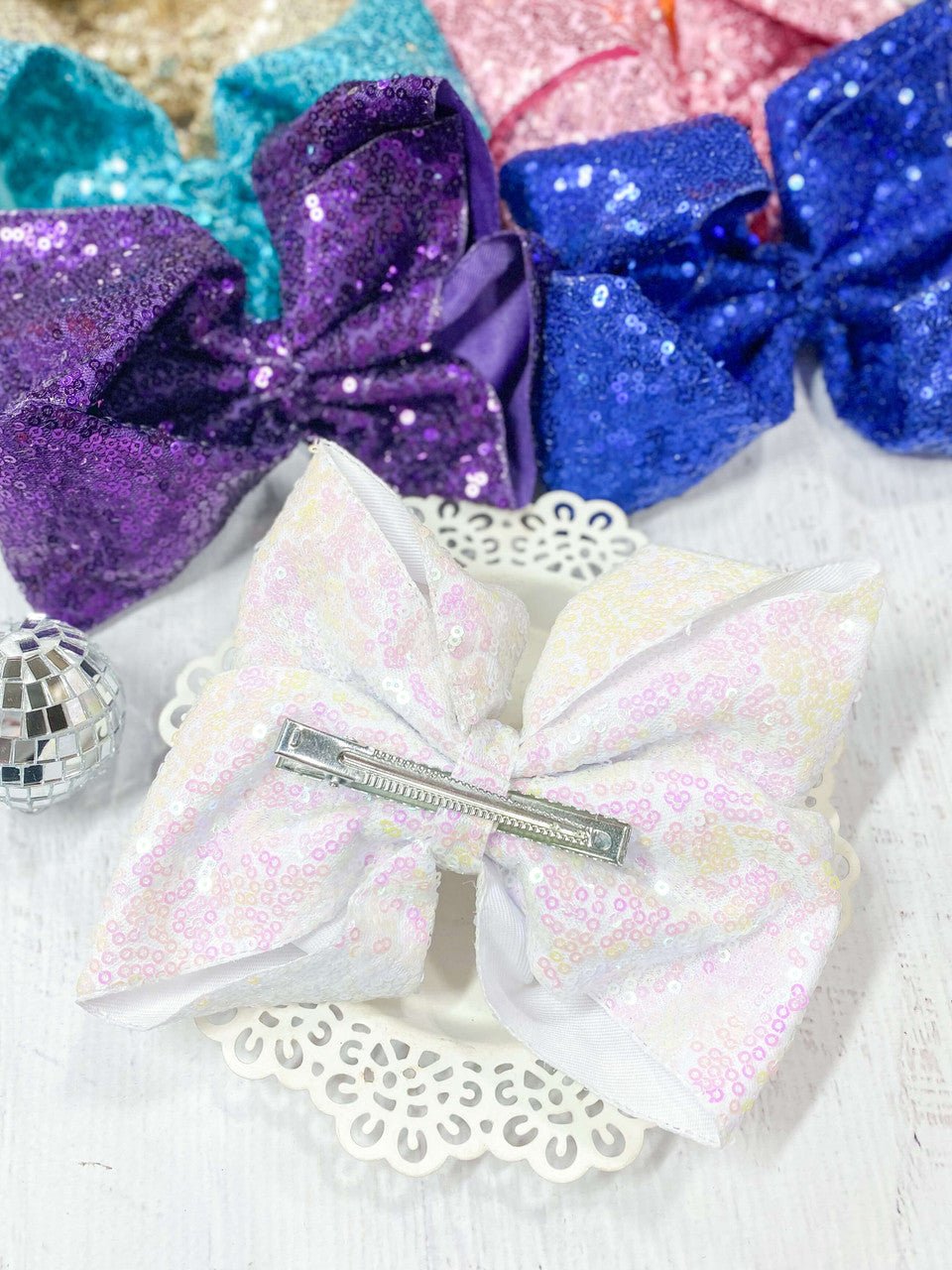 back of a pearl white texas size sequin bow