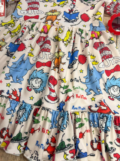 Children's dress with Dr. Seuss character print on a white background