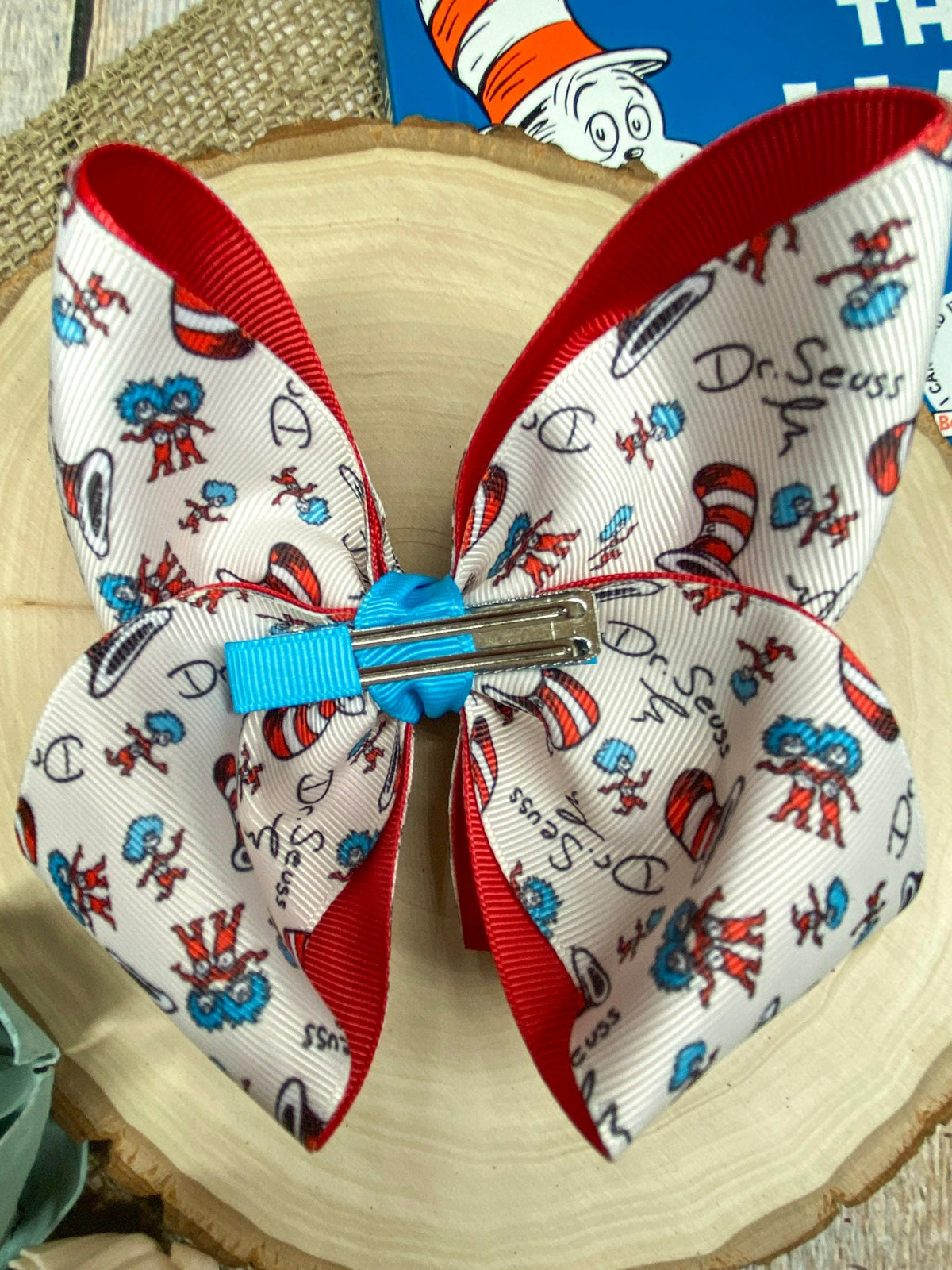 Suess Print Double Layer Hair Bow on a wooden background