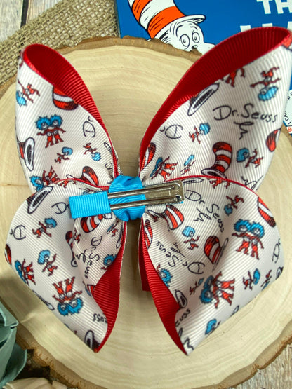 Suess Print Double Layer Hair Bow on a wooden background