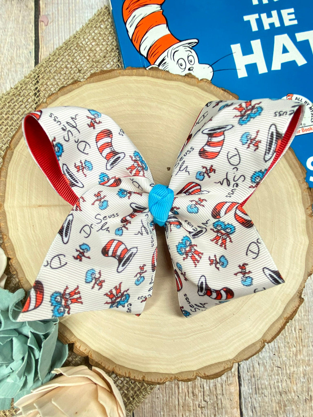 Suess Print Double Layer Hair Bow on a wooden background