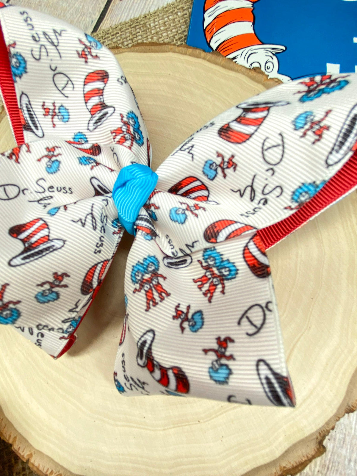 Suess Print Double Layer Hair Bow on a wooden background