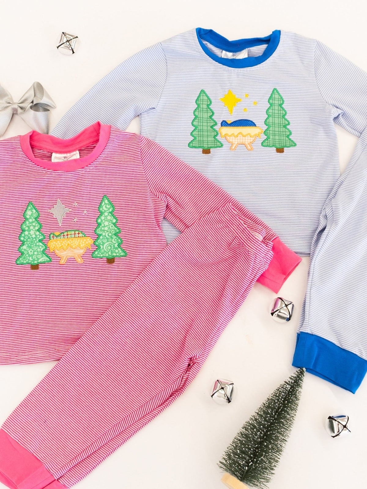 Boys blue and girls pink matching Silent Night Christmas pajamas side by side