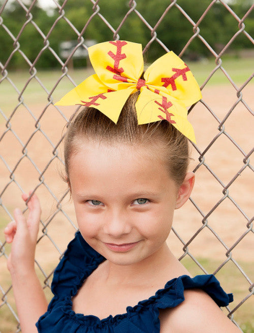 Softball Cheer Bow for Girls shown on model from front angle